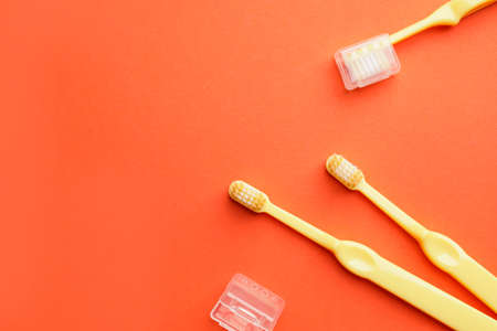 Toothbrushes on color background