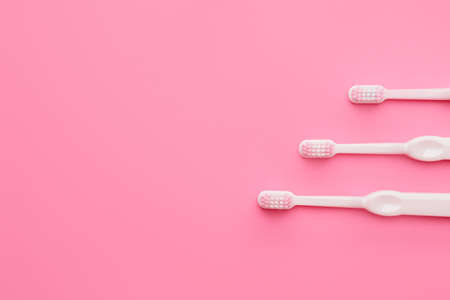 Toothbrushes on color backgroundの写真素材