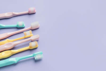 Toothbrushes on color backgroundの写真素材