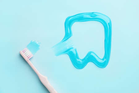 Toothbrush and paste on color backgroundの写真素材