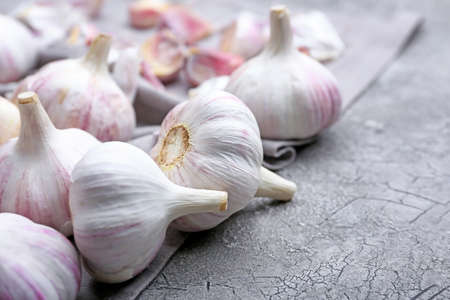 Fresh garlic on gray background