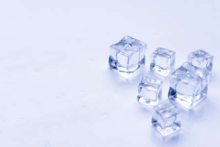 Ice cubes on light background