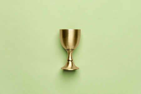 Sacramental goblet for wine on color background. Rosh hashanah (Jewish New Year) celebrationの写真素材