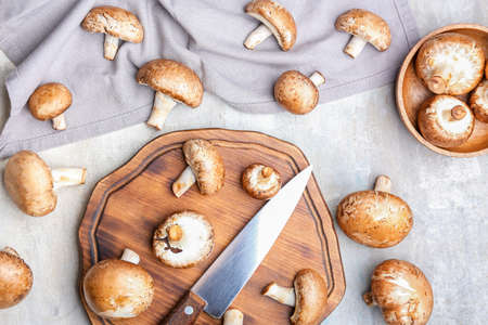 Composition with raw mushrooms on table