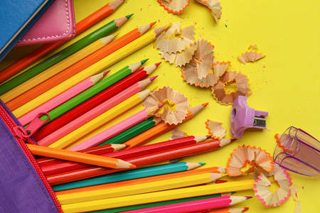 Ordinary pencils with stationery on color background