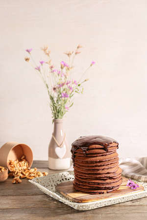 Tray with delicious chocolate pancakes on tableの写真素材
