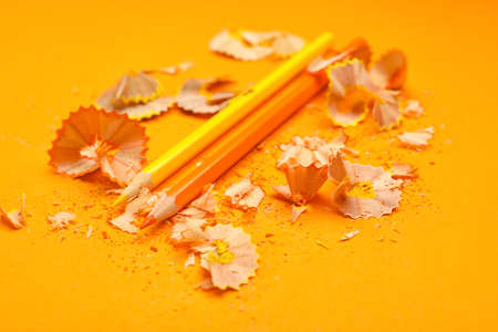 Ordinary pencils and shavings on color backgroundの写真素材