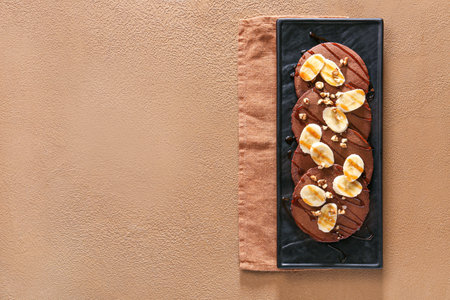 Plate with delicious chocolate pancakes on color backgroundの写真素材