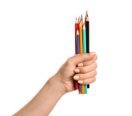 Female hand with pencils on white backgroundの写真素材