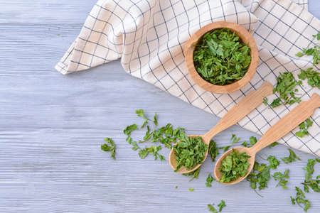 Dry parsley on wooden backgroundの写真素材