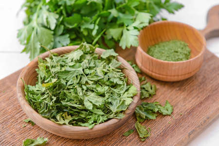 Healthy dry parsley on wooden table