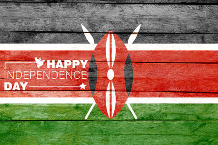 Text HAPPY INDEPENDENCE DAY and national flag of Kenya on wooden backgroundの写真素材