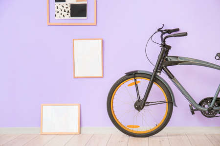 Interior of modern room with bicycle and blank photo framesの写真素材