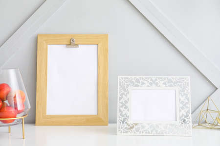 Photo frames on table in room