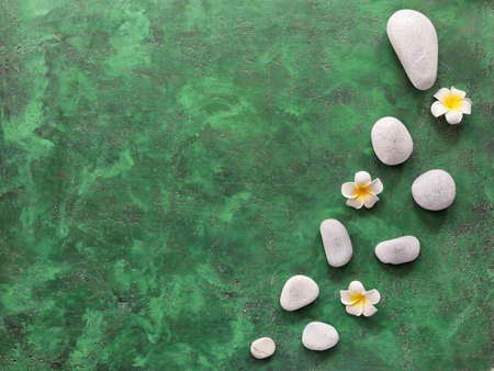 Spa stones and flowers on color background. Zen conceptの写真素材