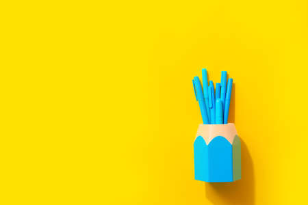 Pens and markers on color background