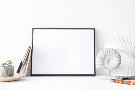 Photo frame on table in roomの写真素材