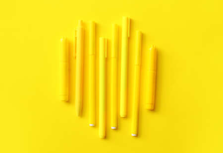 Pens and markers on color backgroundの写真素材