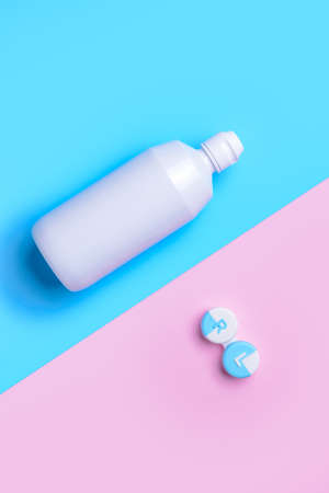 Container with contact lenses and solution on color backgroundの写真素材