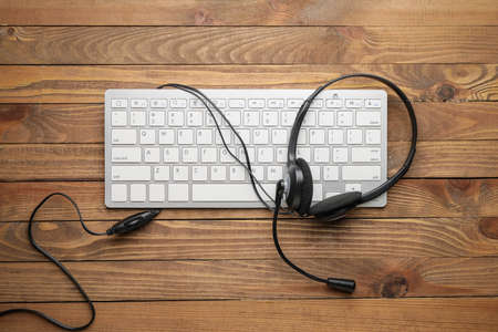 Headset with computer keyboard on table