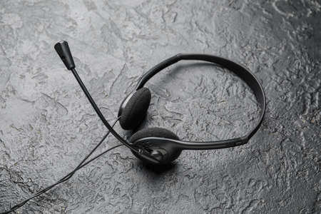 Headphones with microphone on dark background