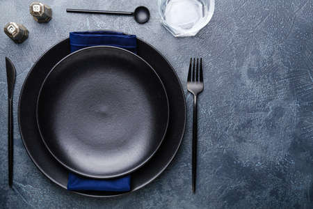 Simple table setting on dark backgroundの写真素材