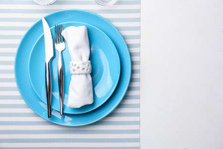 Simple table setting on light backgroundの写真素材