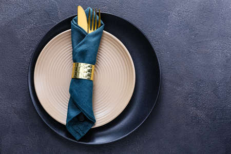 Beautiful table setting on dark background