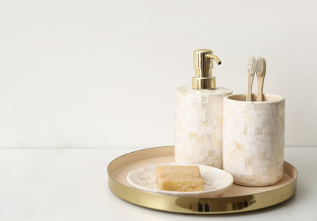 Soap and toothbrushes on light backgroundの写真素材