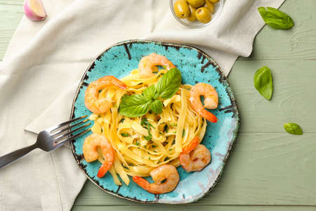 Plate of tasty pasta with shrimps on tableの写真素材