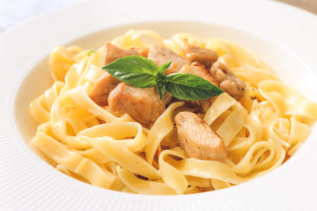 Plate of tasty pasta with chicken, closeupの写真素材