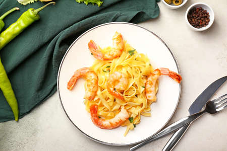 Plate of tasty pasta with shrimps on tableの写真素材