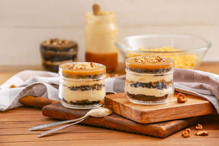 Delicious cupcakes in jars on tableの写真素材