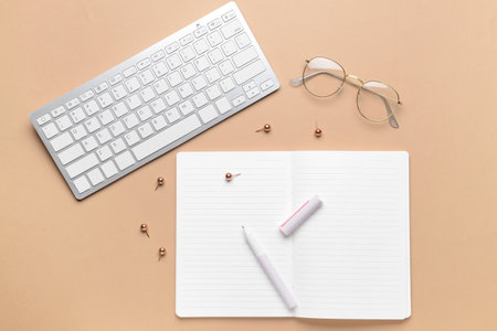 Blank notebook with pen on color backgroundの写真素材