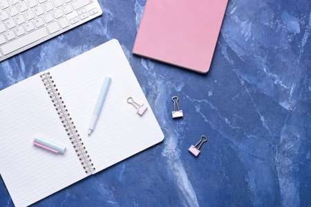 Notebooks with pen on color backgroundの写真素材