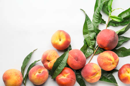 Many ripe peaches on light backgroundの写真素材