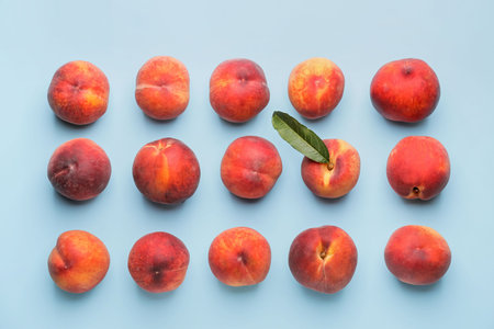 Many ripe peaches on color backgroundの写真素材