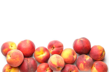 Many ripe peaches on light backgroundの写真素材