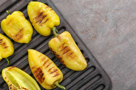 Roasted bell peppers in grill panの写真素材