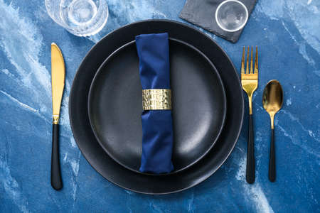 Beautiful table setting on color background