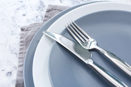 Simple table setting on light backgroundの写真素材