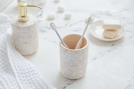 Set of bath accessories on light tableの写真素材