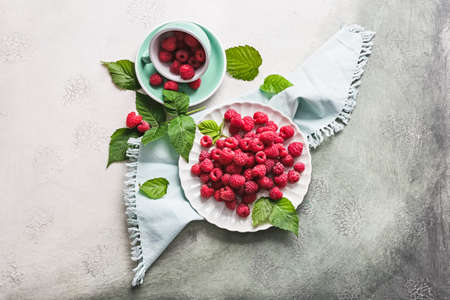 Tasty ripe raspberries on light backgroundの写真素材