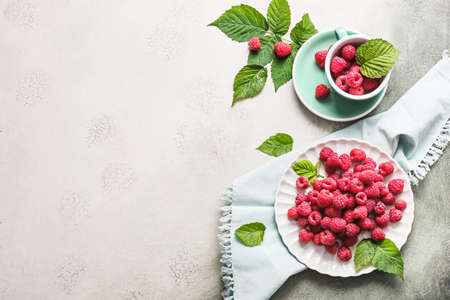 Tasty ripe raspberries on light backgroundの写真素材