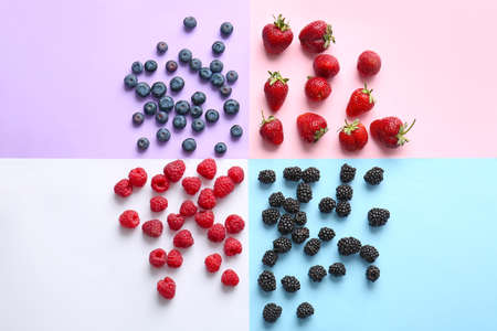 Tasty fresh berries on color backgroundの写真素材