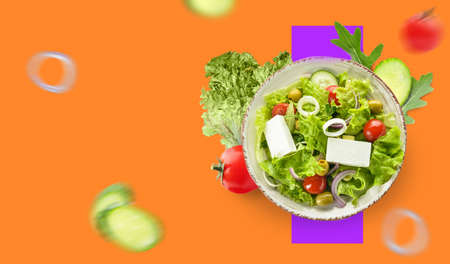Plate with healthy salad and flying ingredients on color backgroundの写真素材