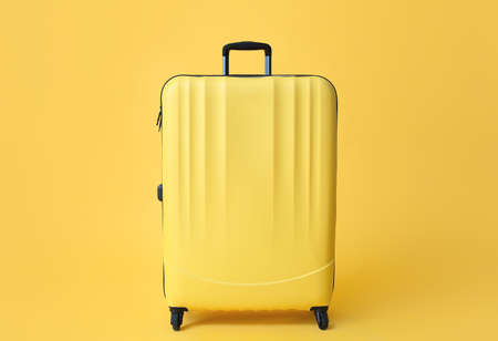 Packed suitcase on color background. Travel conceptの写真素材
