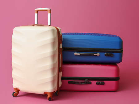 Packed suitcases on color background. Travel conceptの写真素材