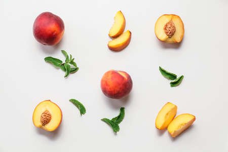 Sweet ripe peaches on white backgroundの写真素材