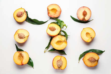 Sweet ripe peaches on white backgroundの写真素材